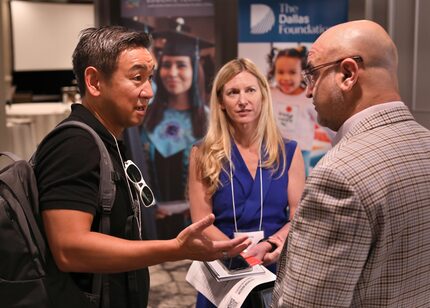 George Tang, left, Dottie Smith, and Aylon Samouha discuss education techniques during the...