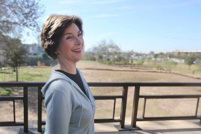 In this Oct. 29, 2012 photo, former first lady Laura Bush smiles during a tour of the George...