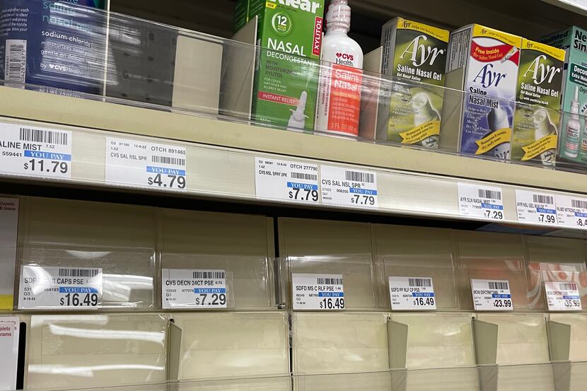 An empty shelf of flu-cold medicine at a CVS pharmacy on Dec. 10, 2022, in Richardson, Texas.