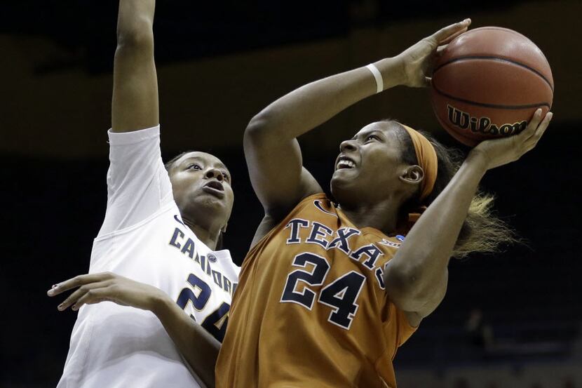 Texas guard Ariel Atkins (right) shoots against California's Courtney Range during the...