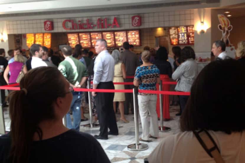 Customers stood in line at a Chick-fil-A in downtown Dallas during Wednesday’s Chick-fil-A...