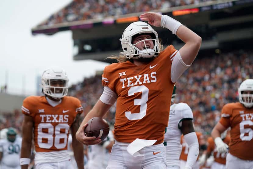 Texas quarterback Quinn Ewers (3) celebrates after scoring a touchdown against Baylor during...