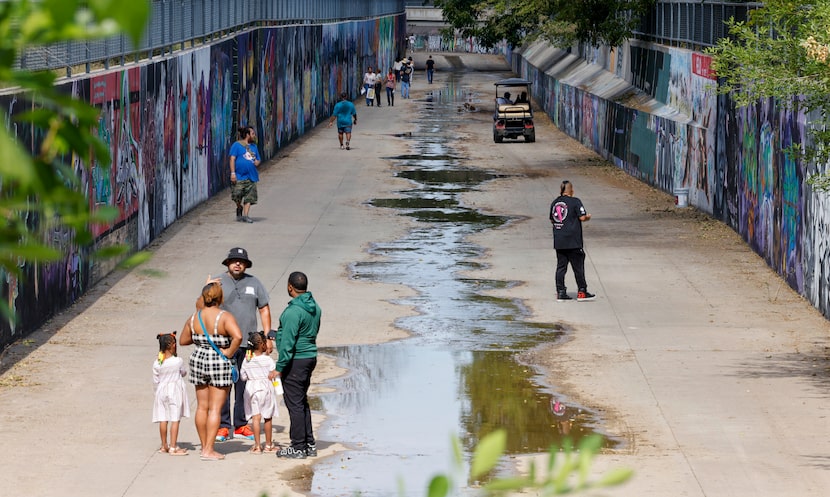 People walk through “The Walls” during Styles Fest in Pleasant Grove on Oct. 15 in Dallas.