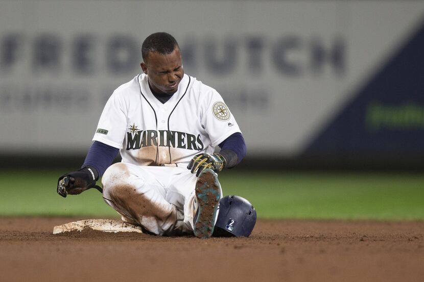 SEATTLE, WA - MAY 26: Jean Segura #2 of the Seattle Mariners reacts after a collision with...