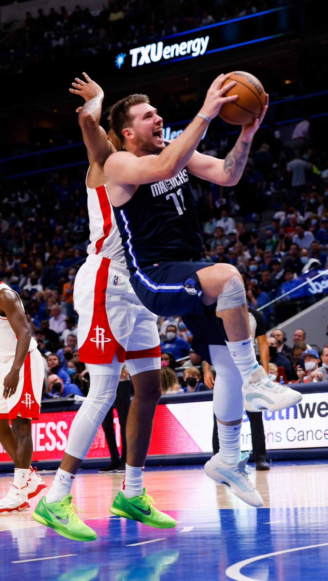 Dallas Mavericks guard Luka Dončić (77) goes up for a shot during the fourth quarter of the...