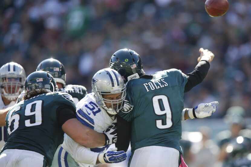 Dallas Cowboys defensive end Kyle Wilber (51) hits Philadelphia Eagles quarterback Nick...