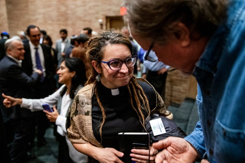 The Rev. Rachel Baughman, senior pastor at Oak Lawn United Methodist Church, speaks with an...