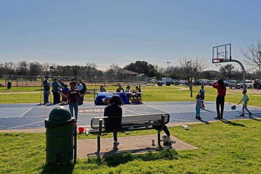 Kids play basketball during the Census Fun Day at Jaycee Zaragoza Park Pavilion in Dallas,...