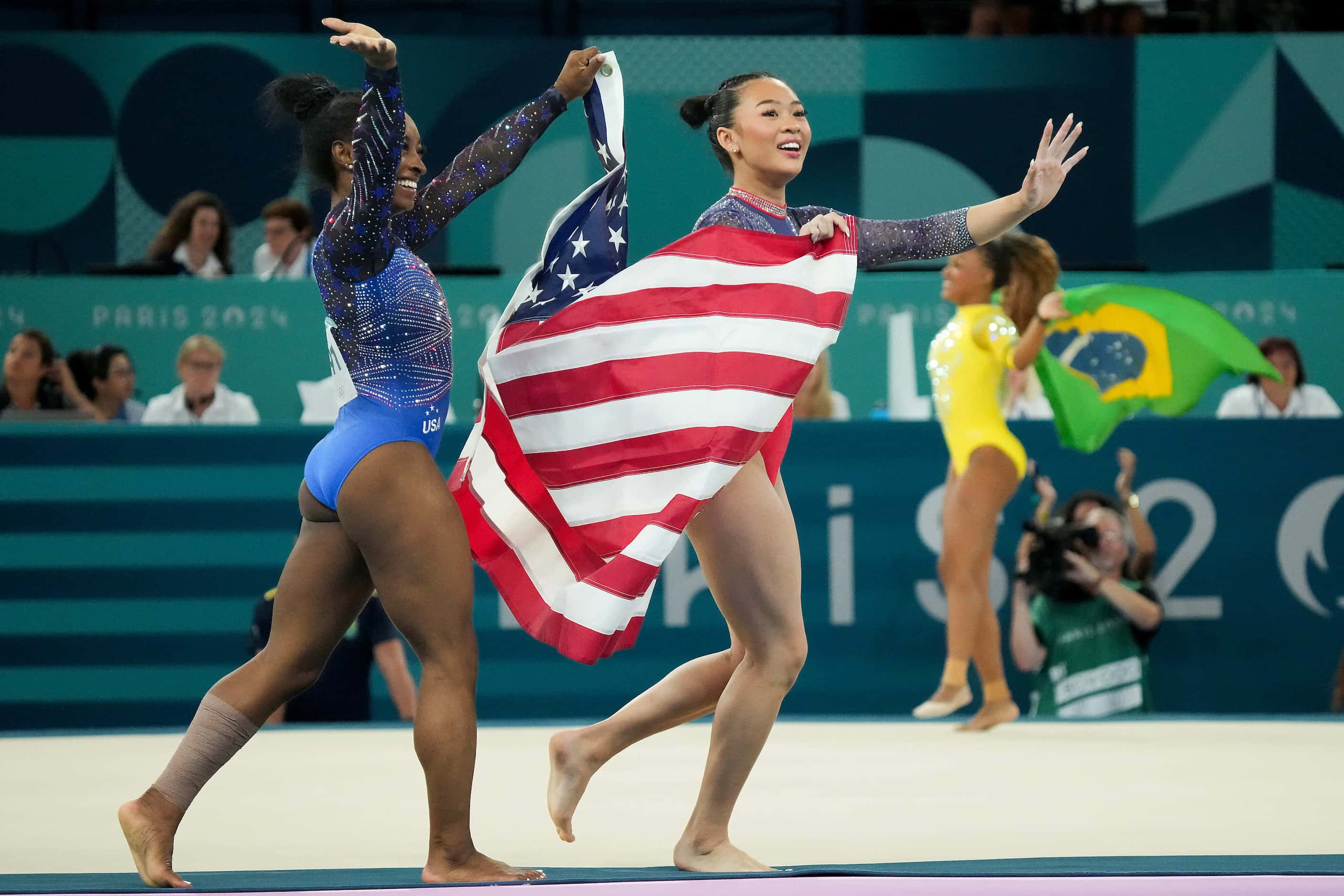 Gold medalist Simone Biles (left) and bronze medalist Suni Lee of the United States...