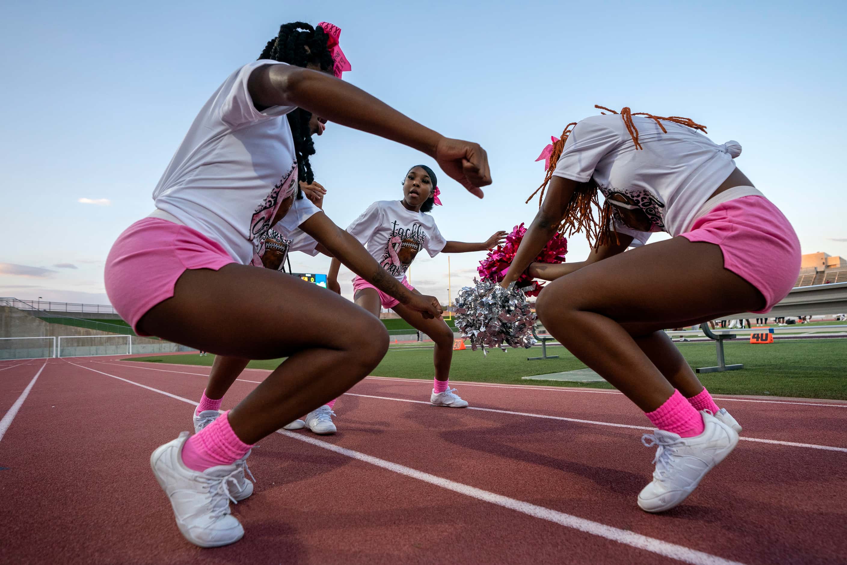 Kimball cheerleaders dance before a high school football game against South Oak Cliff on...