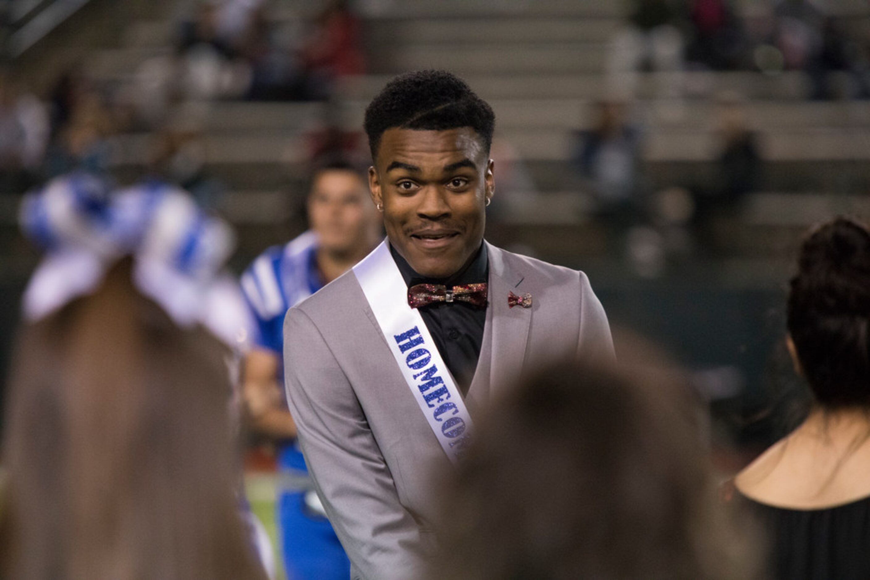 Grand Prairie's Caleb Clark reacts to being named Homecoming King during a District 7-6A...