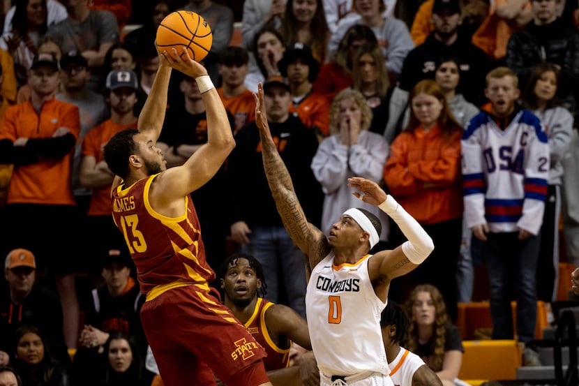 Iowa State's Jaren Holmes (13) shoots over Oklahoma State's Avery Anderson III (0) in the...