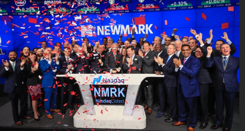 Emmitt Smith (front row, third from right) was on hand in New York last month when Newmark...