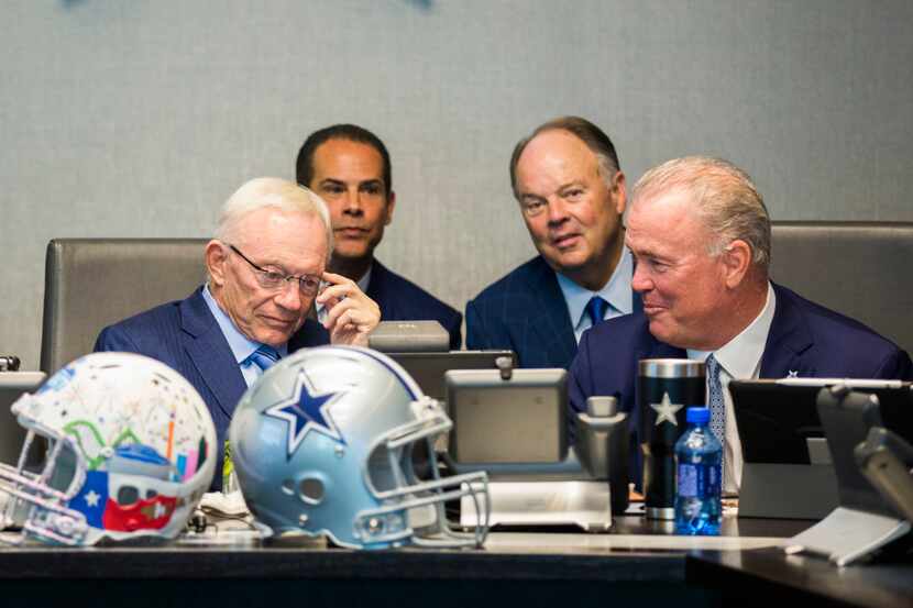Dallas Cowboys Owner Jerry Jones, CEO and Executive Vice President Stephen Jones, right, and...