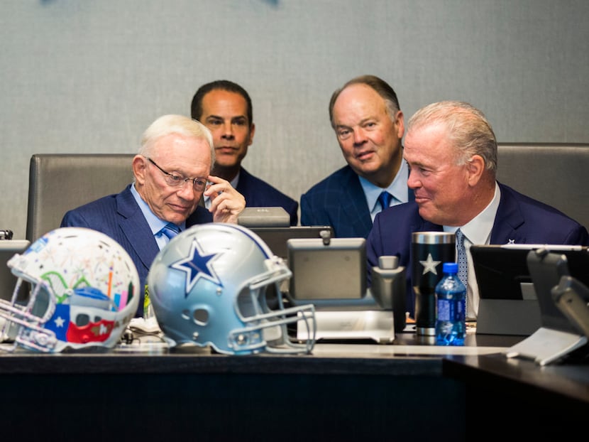Dallas Cowboys Owner Jerry Jones, CEO and Executive Vice President Stephen Jones, right, and...