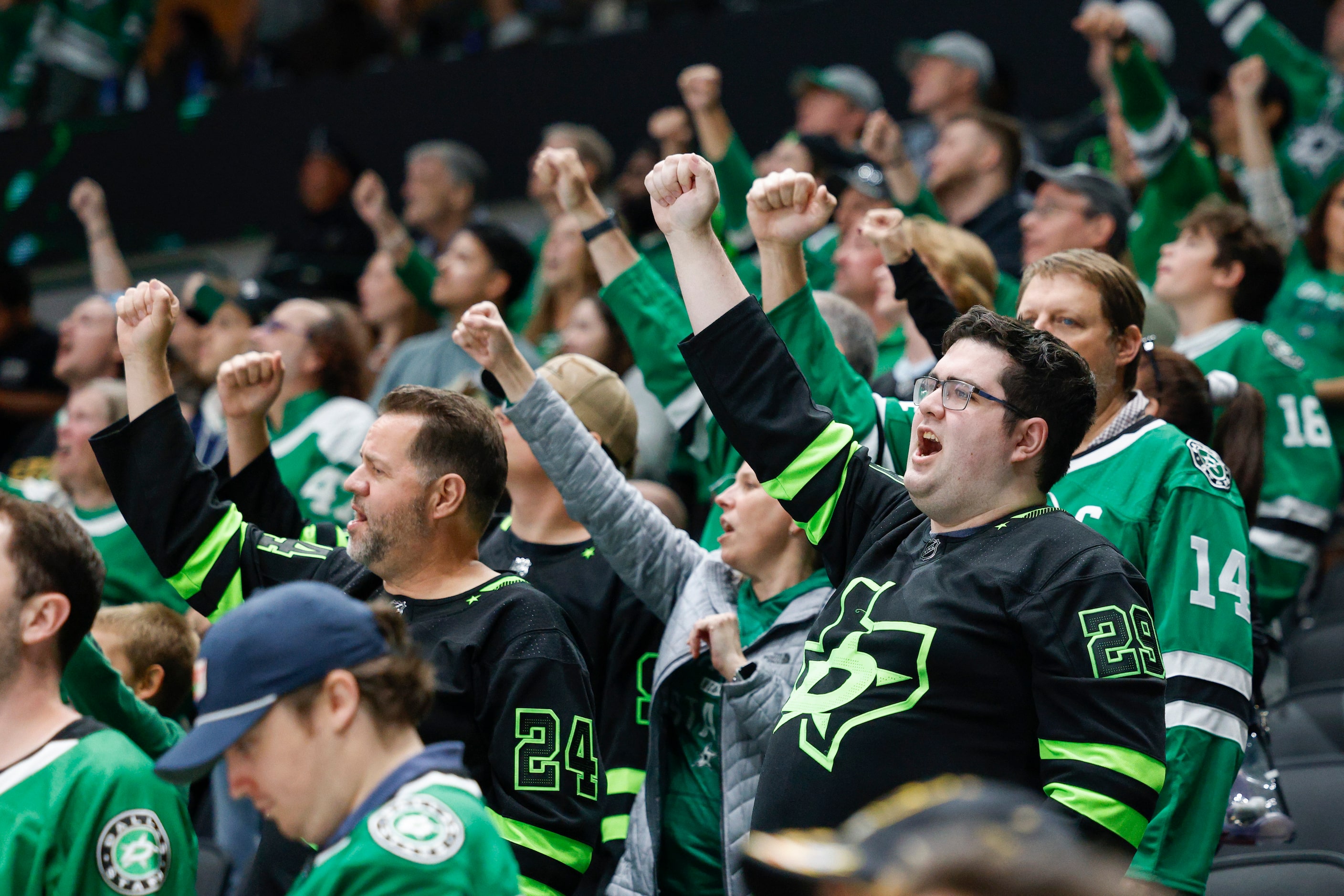 Dallas Stars fans celebrate a goal by center Joe Pavelski (16) during the third period of an...