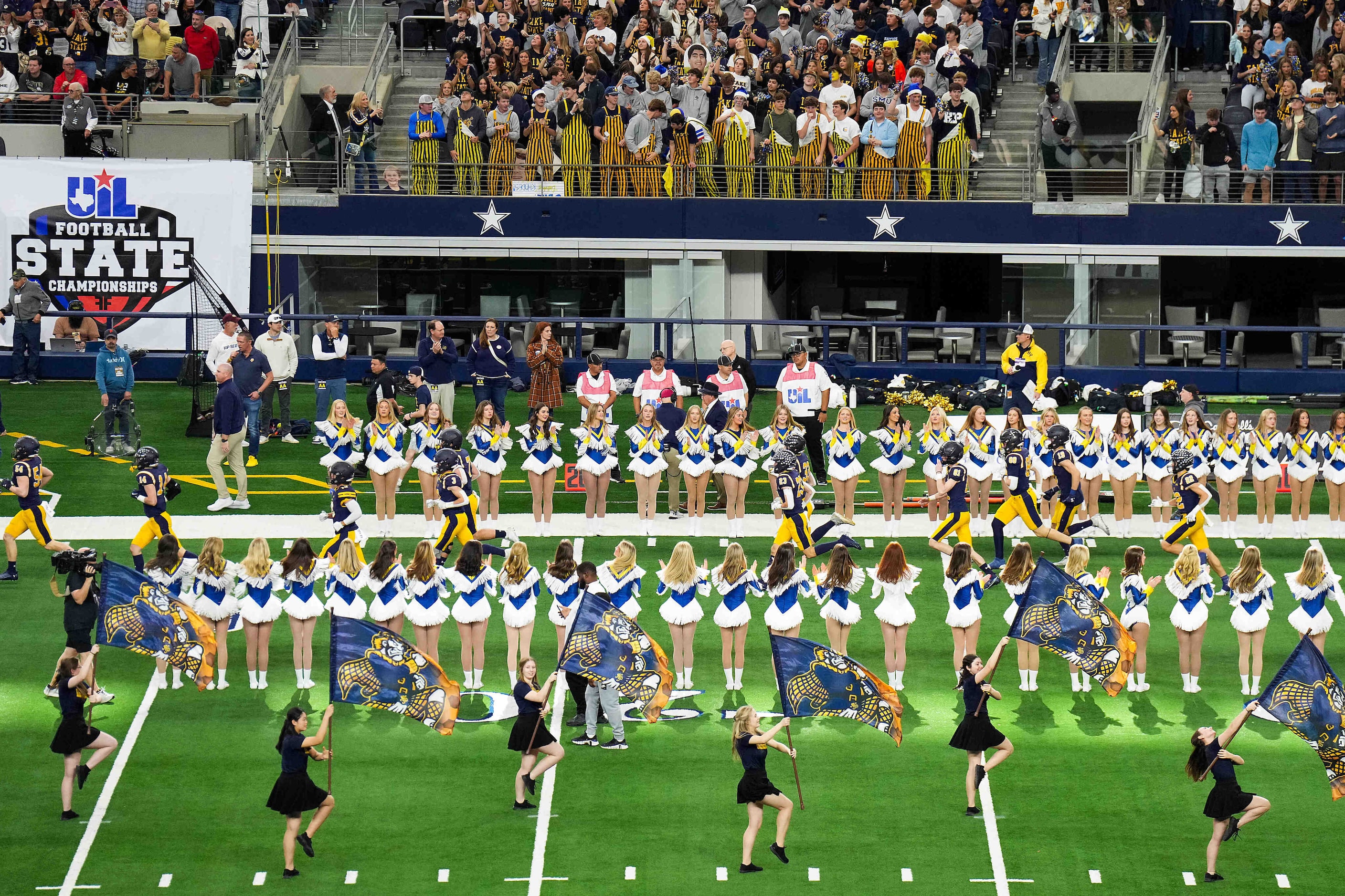 Highland Park players take the field before the Class 5A Division I state football...