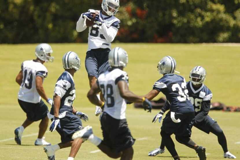 Dallas Cowboys receiver Terrence Williams (83) catches a pass during the last day of mini...