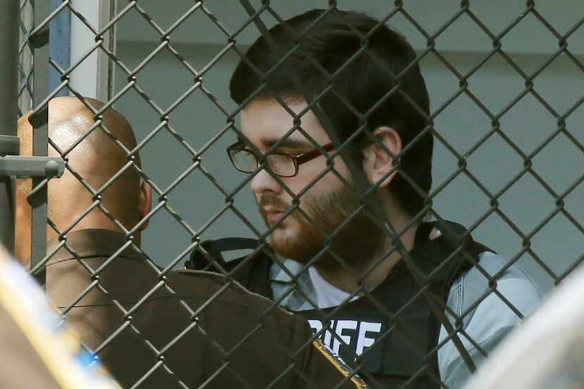 James Alex Fields Jr., is led out of General District Court courthouse after his sentencing...