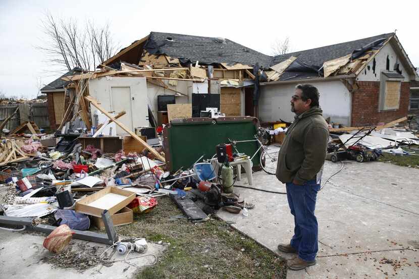 
Days after the Dec. 26 tornado, Felix Salazar surveyed the damage the twister dealt to the...