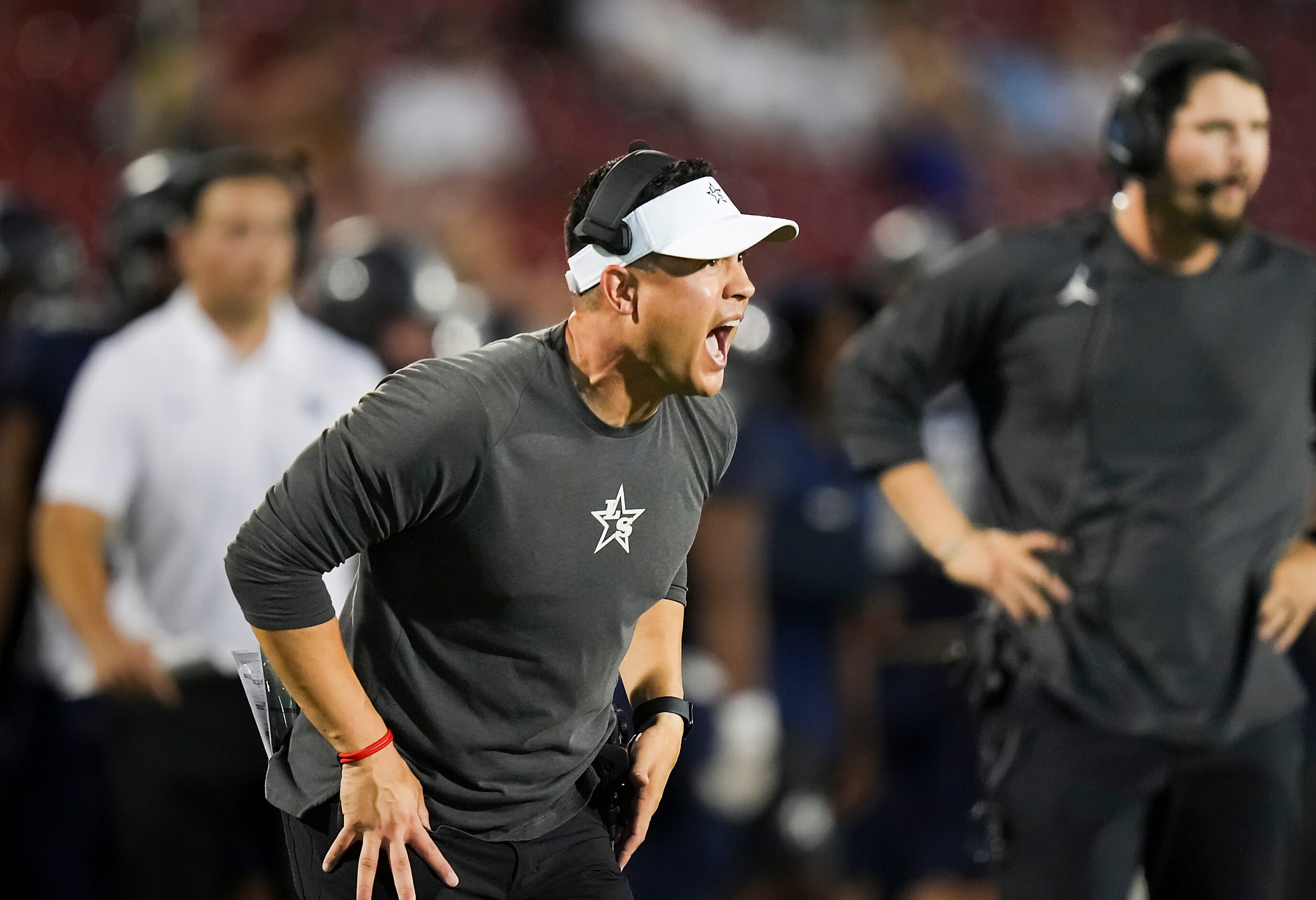 Frisco Lone Star head coach Jeff Rayburn yells to his players during the second half of a a...