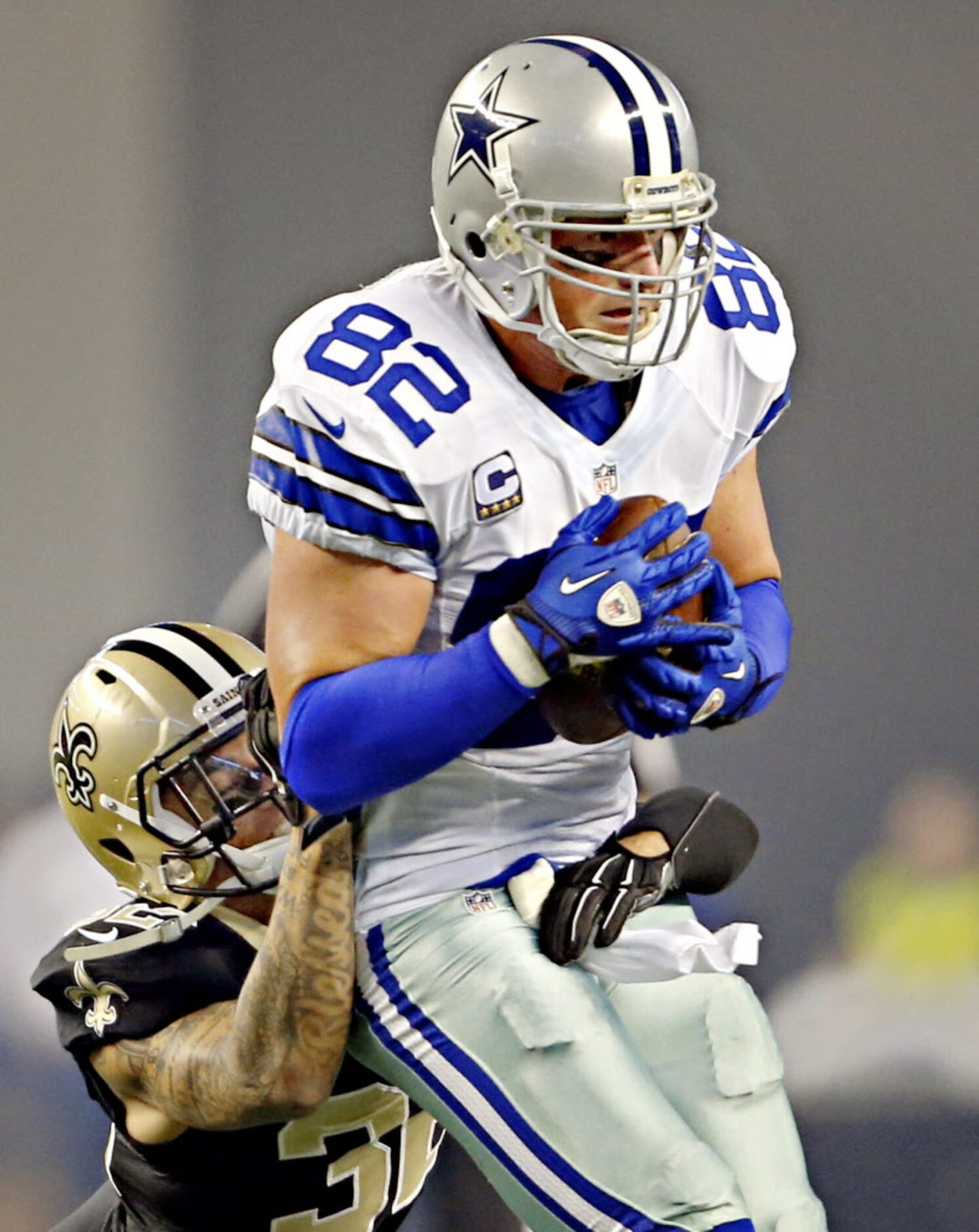 New Orleans Saints strong safety Kenny Vaccaro (32) struggles to tackle Dallas Cowboys tight...