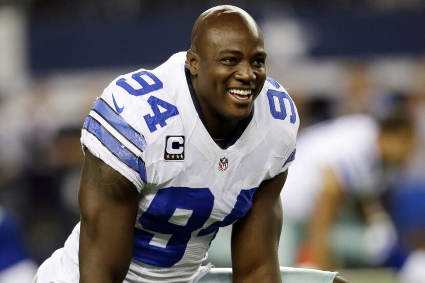 FILE - In this Oct. 13, 2013, file photo, Dallas Cowboys defensive end DeMarcus Ware talks...