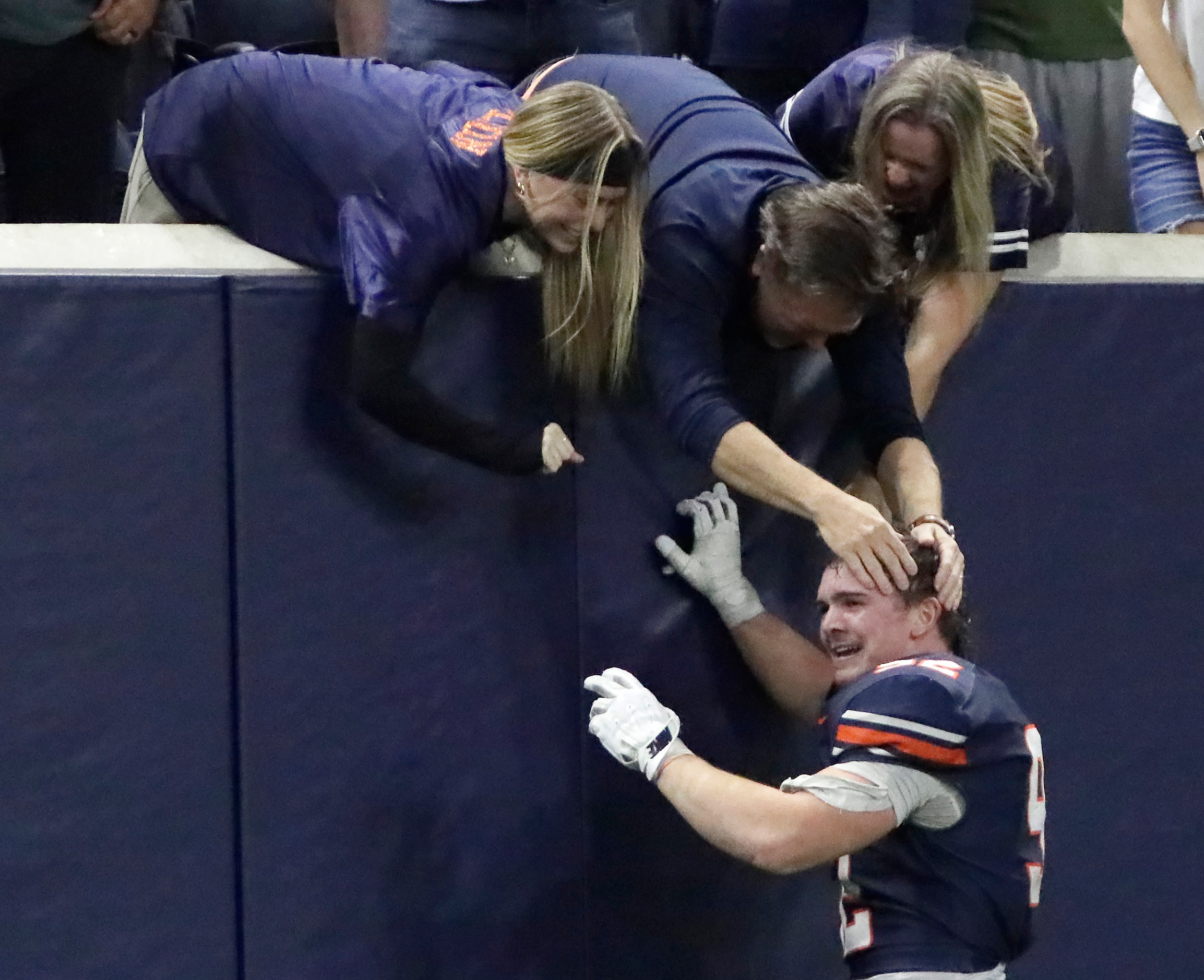 Wakeland High School defensive lineman Austin Wilson (92) interacts with family after Wilson...