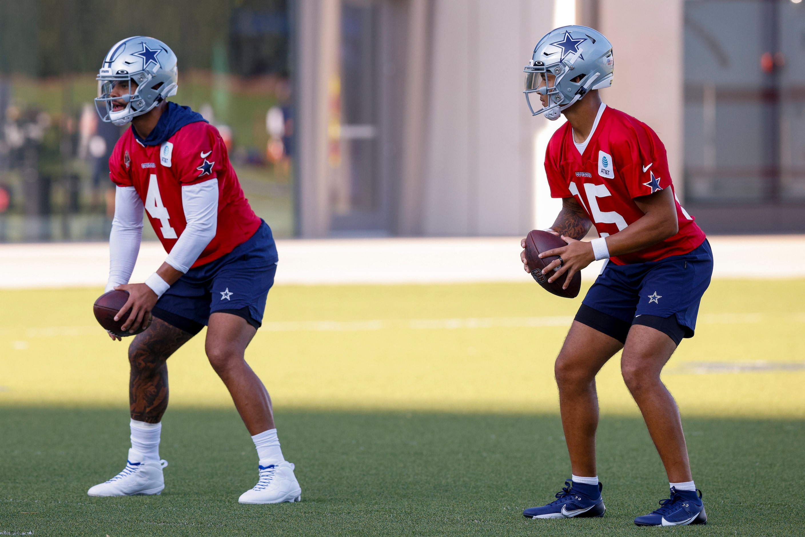 Dallas Cowboys quarterbacks Dak Prescott (4) and Trey Lance (15) practice at The Star,...