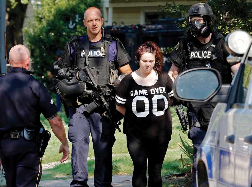 The Dallas police SWAT team took a woman into custody after a six-hour standoff in the 2100...