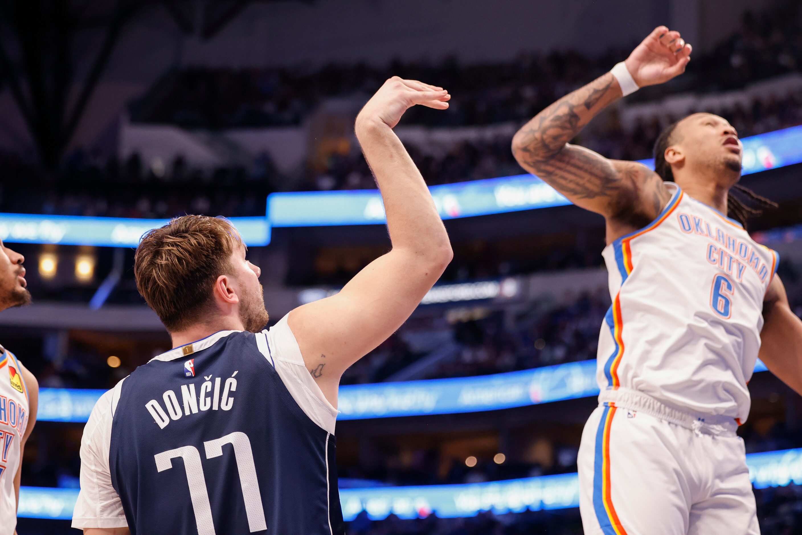 Dallas Mavericks guard Luka Dončić (77) reacts after a successful shot over Oklahoma City...