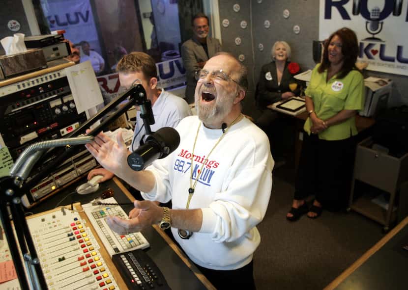 Radio personality Ron Chapman laughs at a comment made by a caller, as he hosts his final...