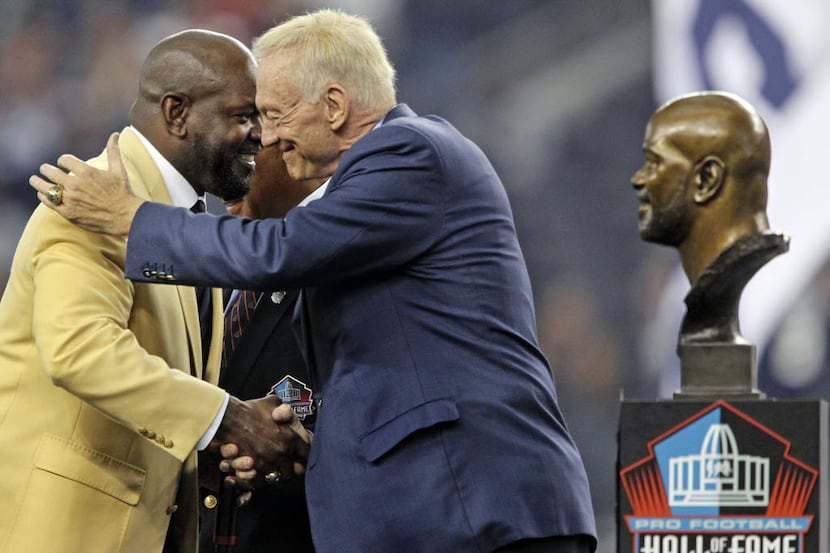 Former Dallas RB Emmitt Smith, left, and owner Jerry Jones are pictured at halftime during...