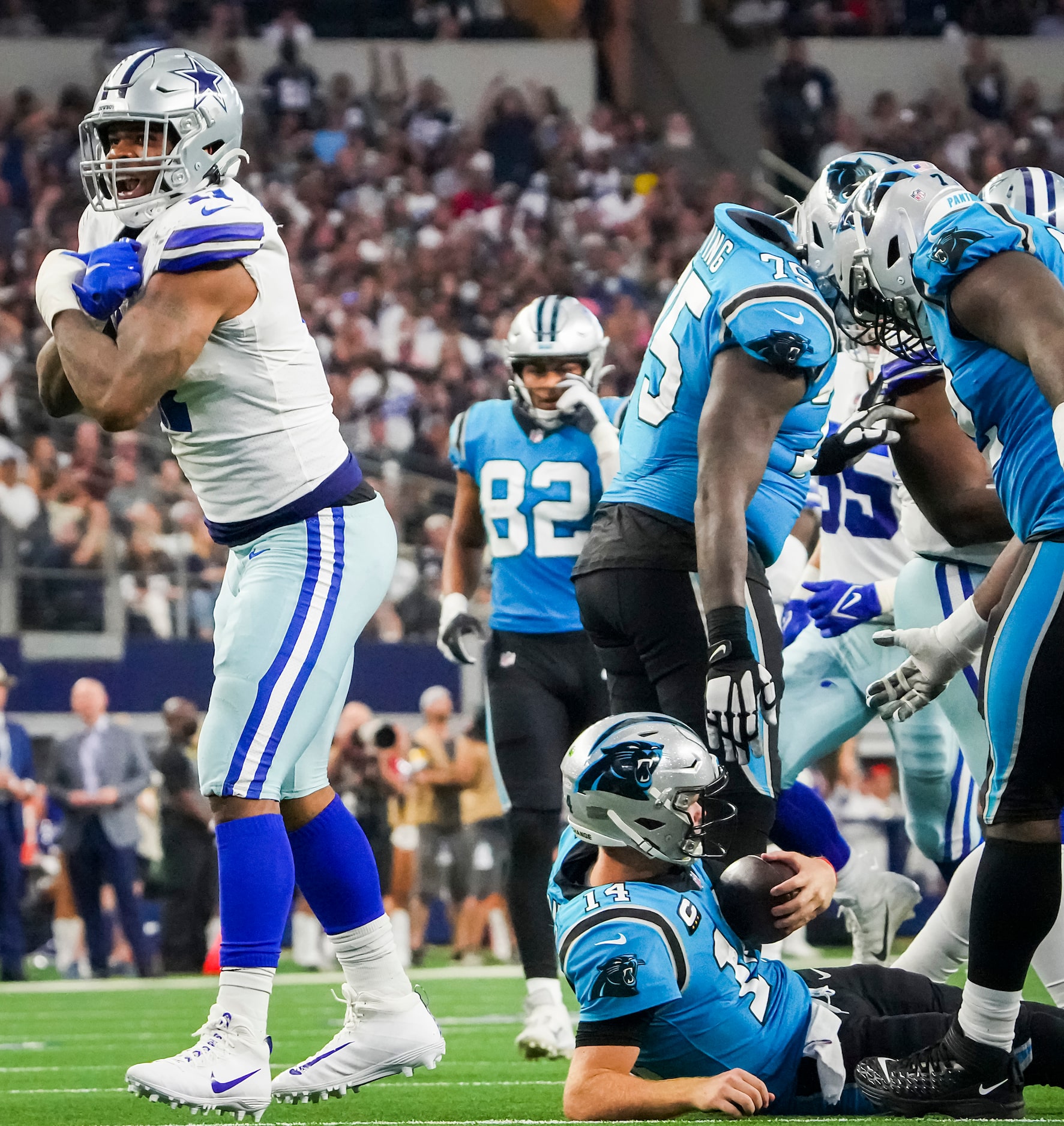 Dallas Cowboys linebacker Micah Parsons (11) celebrates after sacking Carolina Panthers...