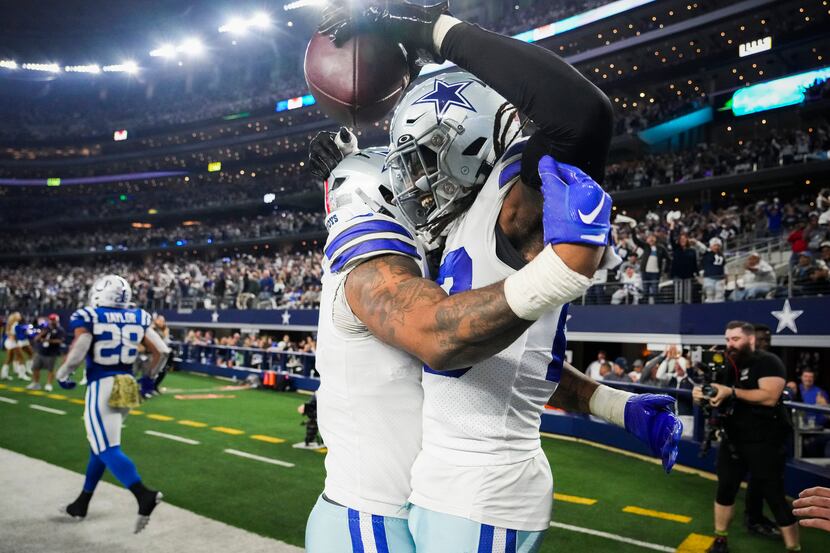Dallas Cowboys safety Malik Hooker (facing) celebrates with linebacker Micah Parsons (11)...