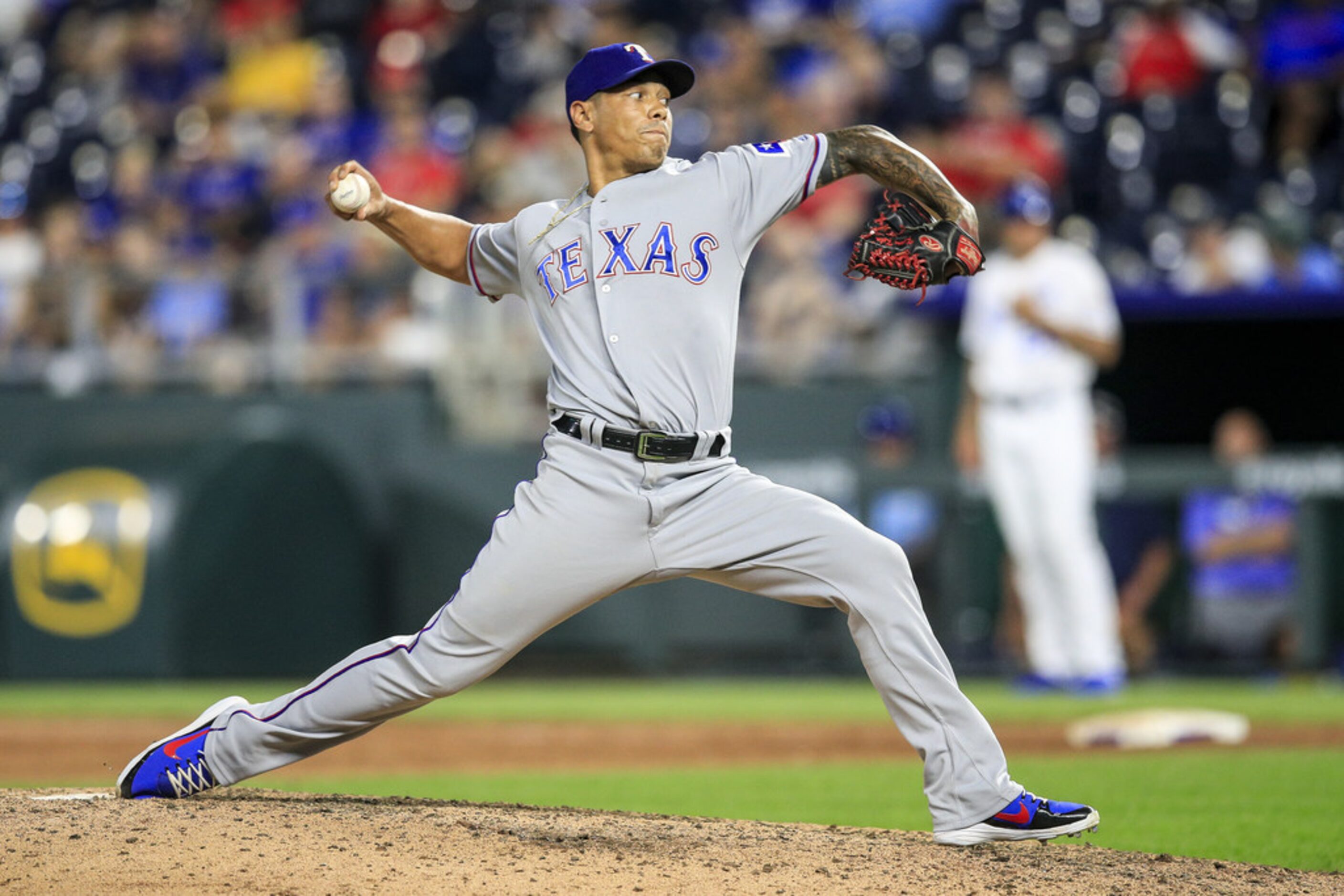 KANSAS CITY, MO - JUNE 18: Keone Kela #50 of the Texas Rangers pitches against the Kansas...