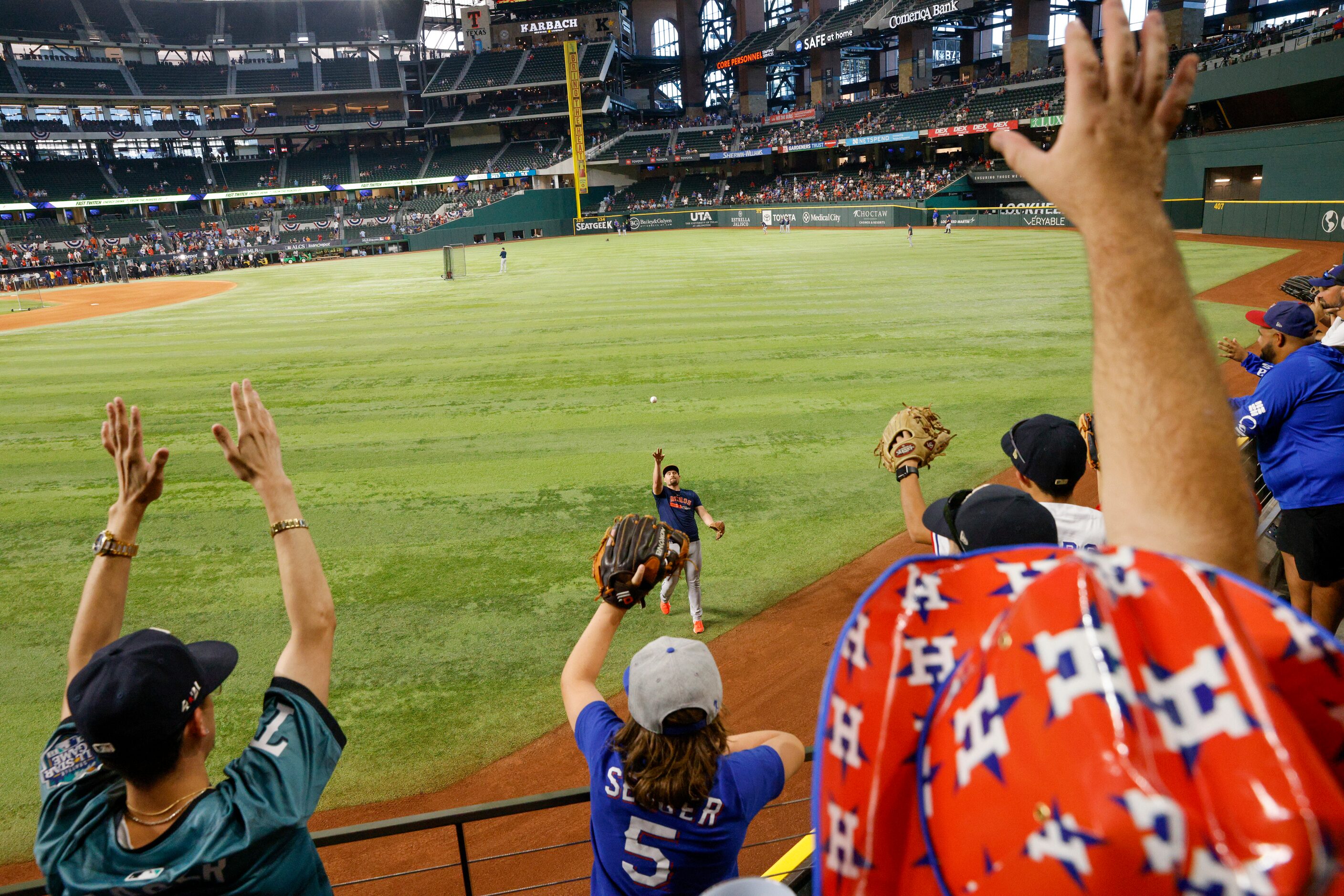 Fans try to catch a baseball during the Houston Astros batting practice before Game 4 of the...