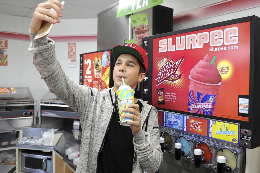 Anyone in Dallas-Fort Worth can get a free Slurpee today. Here, singer Austin Mahone takes a...