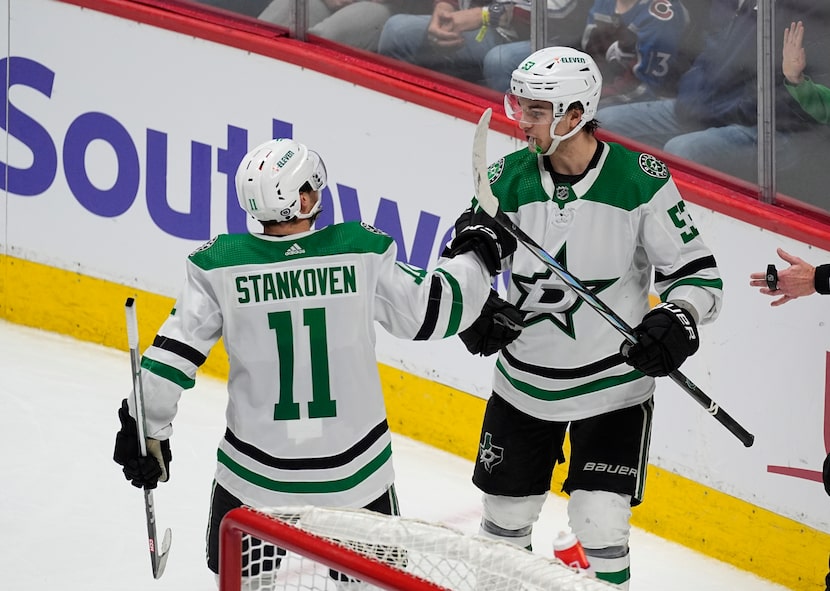 Dallas Stars center Logan Stankoven, left, congratulates center Wyatt Johnston after his...