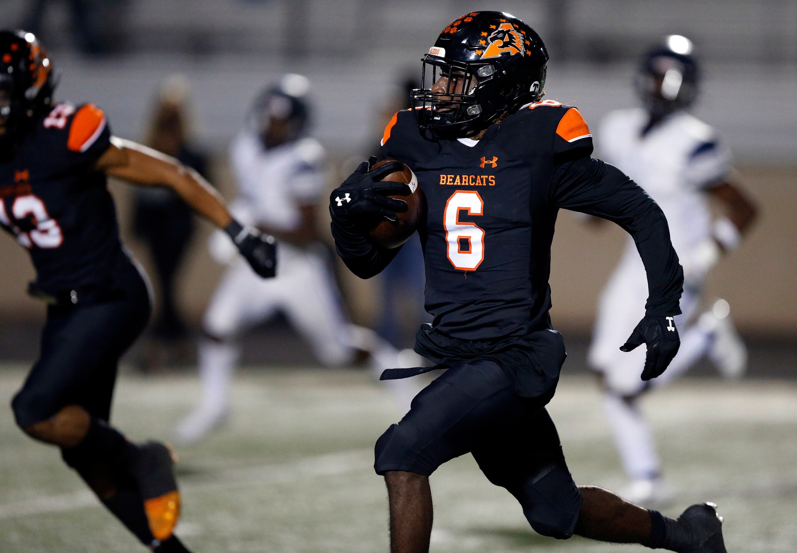 Aledo running back DeMarco Roberts (6) races across the field for a long second quarter...