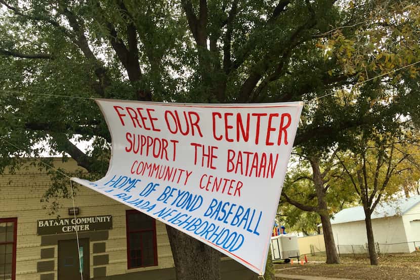 A banner outside the Bataan Community Center highlights the dispute between La Bajada...
