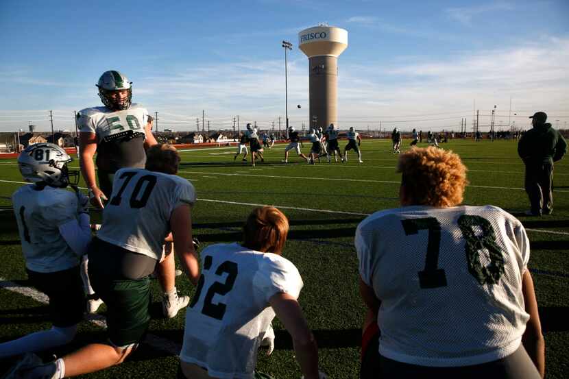 Players rest on the sidelines during Frisco Reedy's practice at Rick Reedy High School in...
