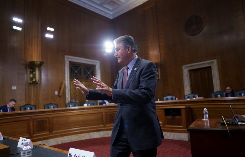 Sen. Joe Manchin, D-W.Va., arrives to greet witnesses as he chairs the Senate Committee on...