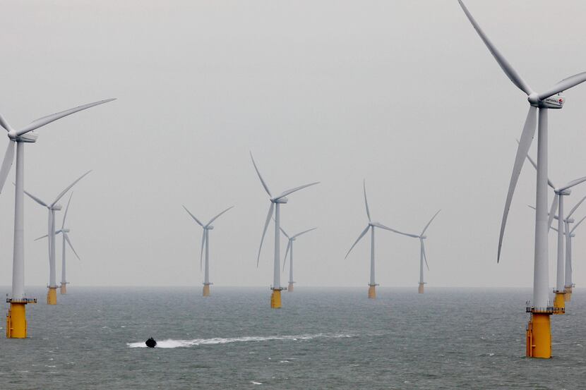 ORG XMIT: LON803 A small boat passes through the windmills of the Thanet Offshore Wind Farm...