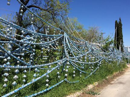 Resident Louis Torres estimates there are 2,000 beer cans decorating the outside of his home...