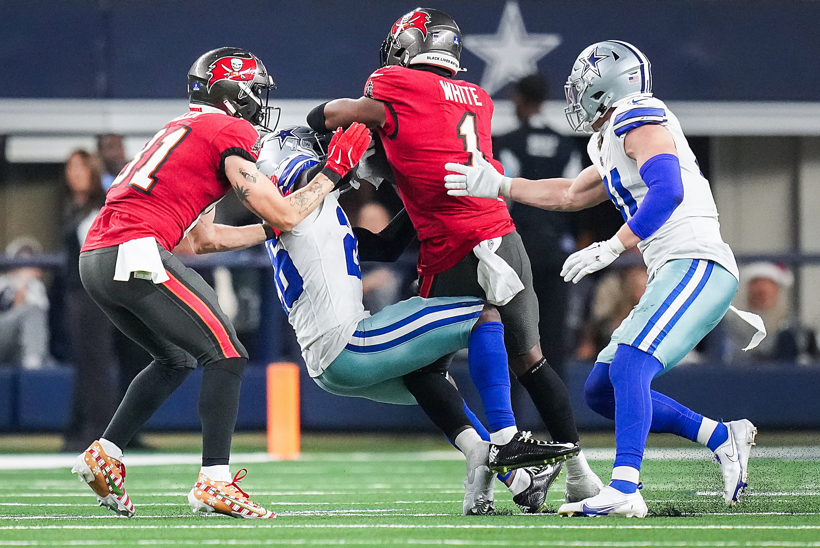 Dallas Cowboys cornerback DaRon Bland (26) strips the ball from Tampa Bay Buccaneers running...