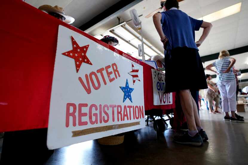 A voter registration table is seen at a political event for Texas gubernatorial candidate...