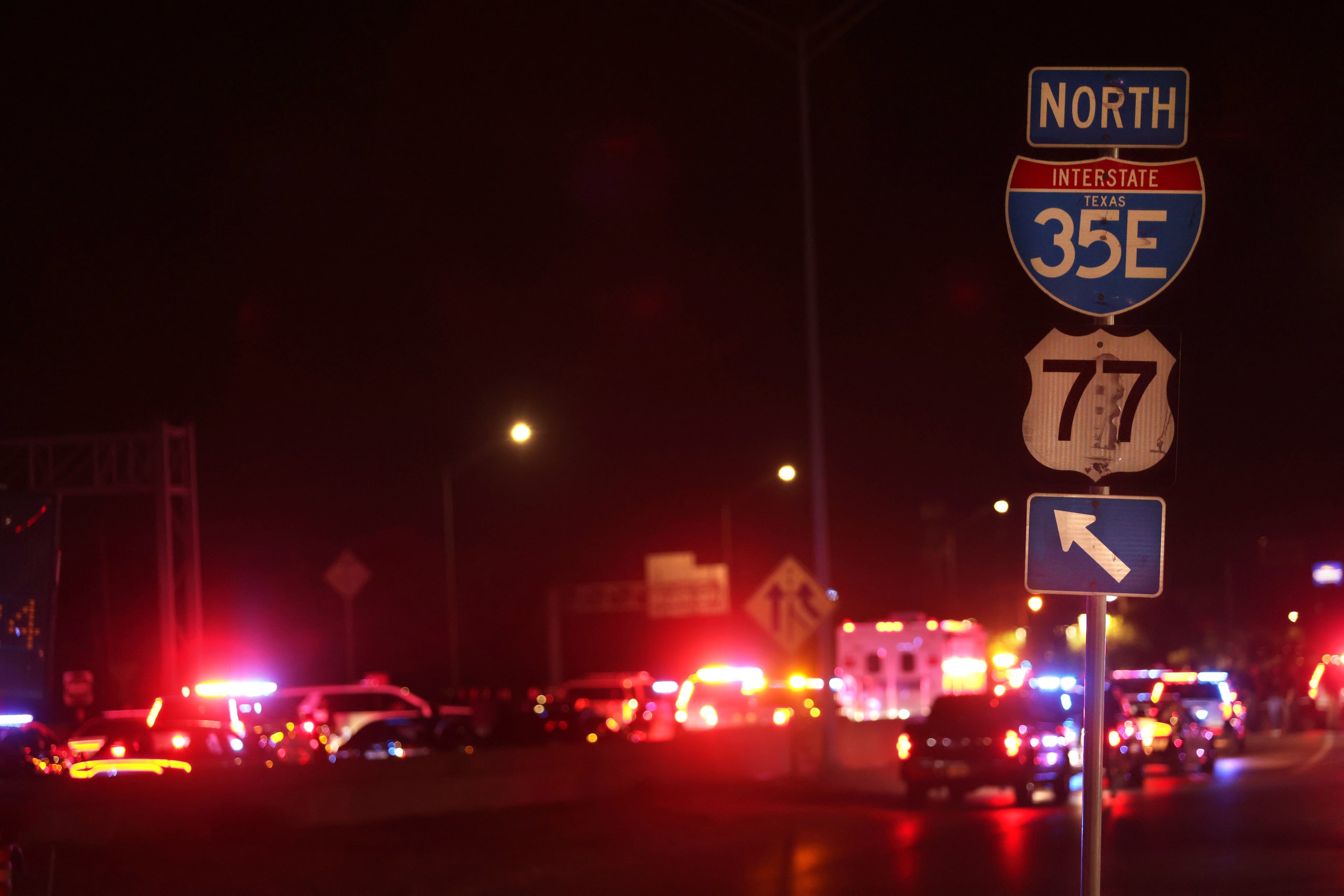 Police cars line Interstate 35 after a shooting in Lewisville, TX, on Aug 30, 2024.