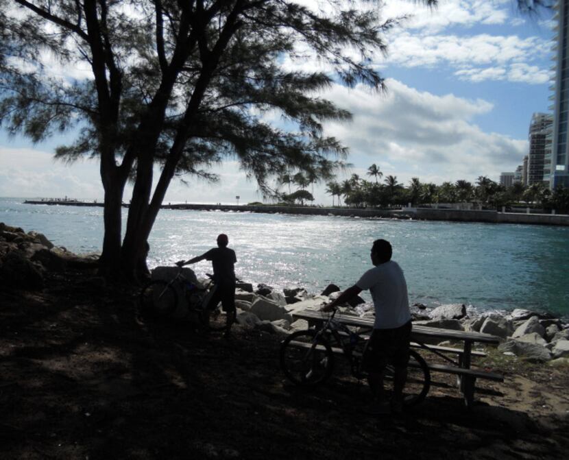 Haulover Inlet at the south end of Sunny Isles Beach, Florida makes a good spot to picnic,...