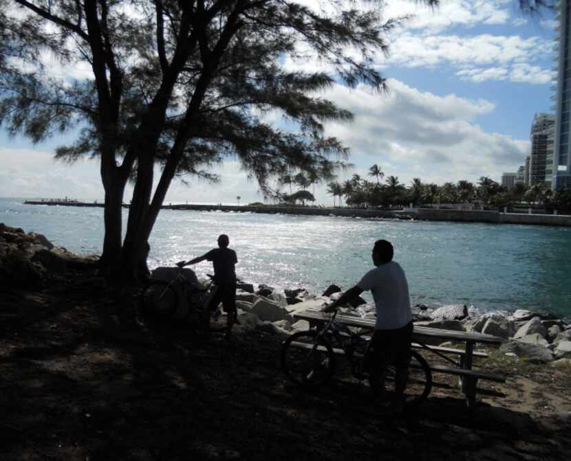 Haulover Inlet at the south end of Sunny Isles Beach, Florida makes a good spot to picnic,...
